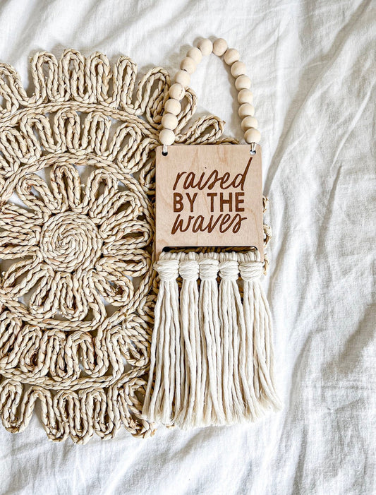 Raised by the waves macrame sign